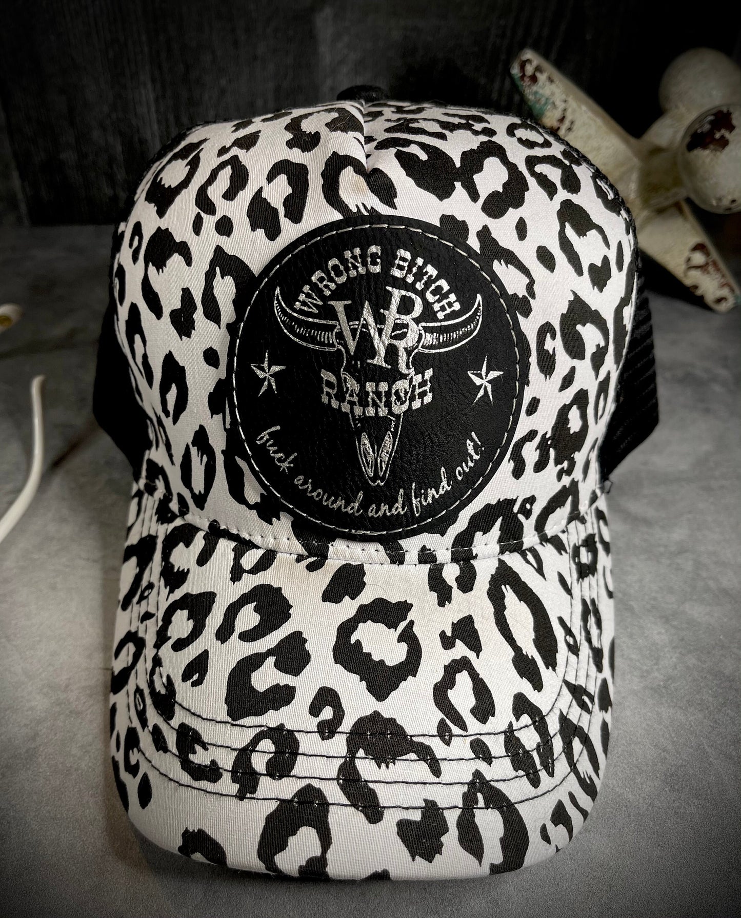 Feed Store Couture, By Joi. Wrong Bitch Ranch, fuck around & find out, womens white or brown leopard reg and ponytail trucker cap