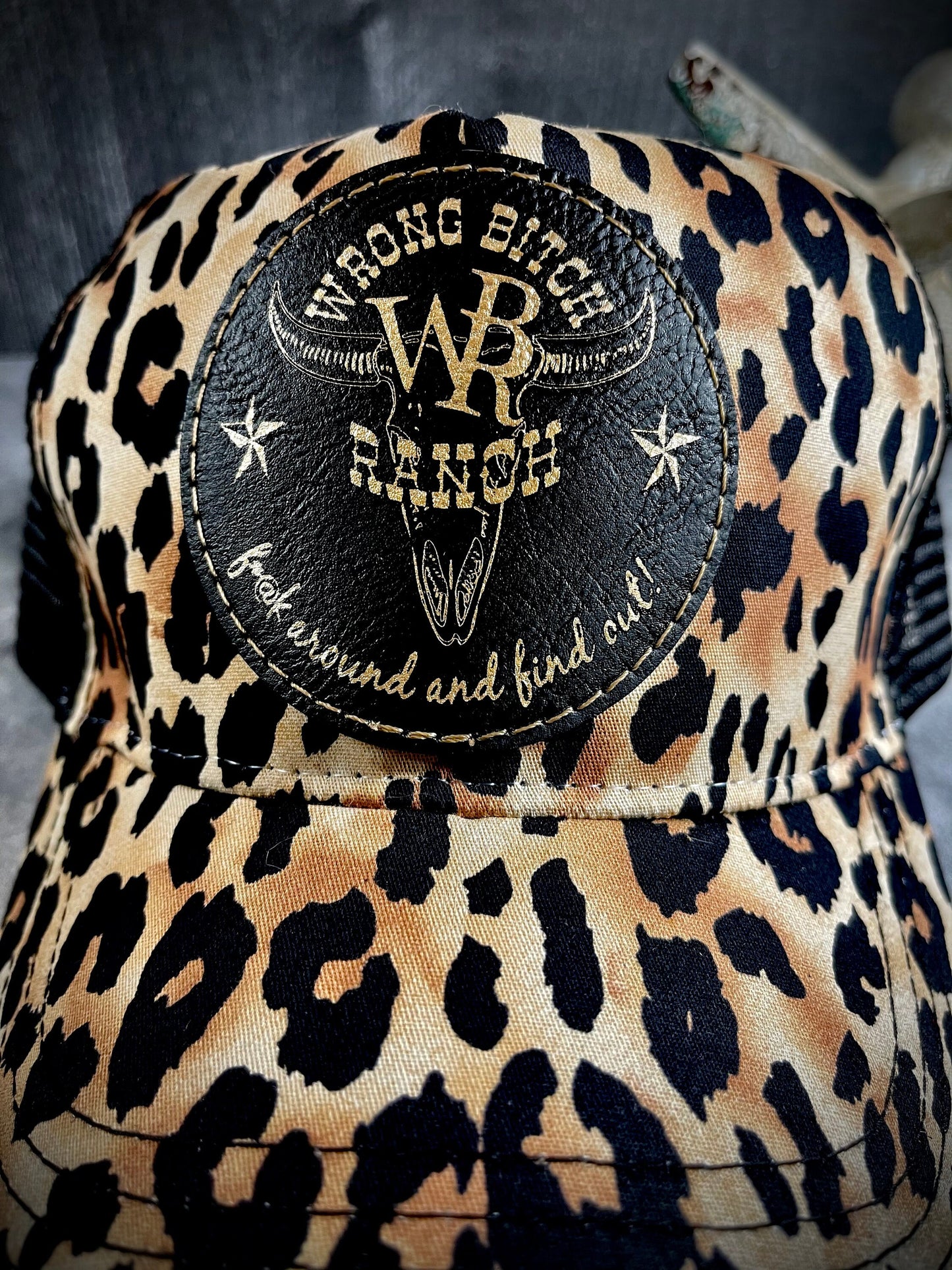 Feed Store Couture, By Joi. Wrong Bitch Ranch, fuck around & find out, womens white or brown leopard reg and ponytail trucker cap