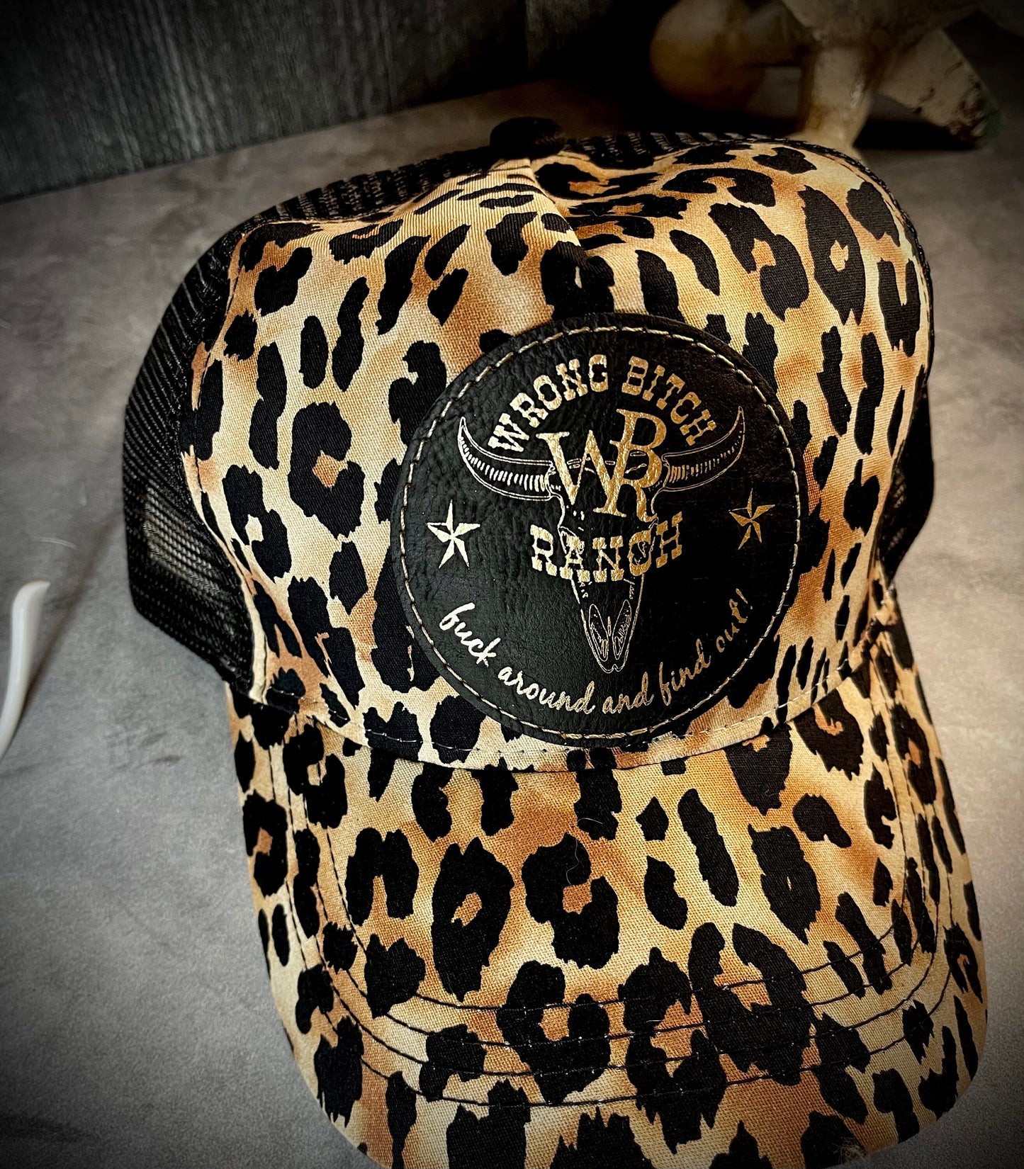 Feed Store Couture, By Joi. Wrong Bitch Ranch, fuck around & find out, womens white or brown leopard reg and ponytail trucker cap