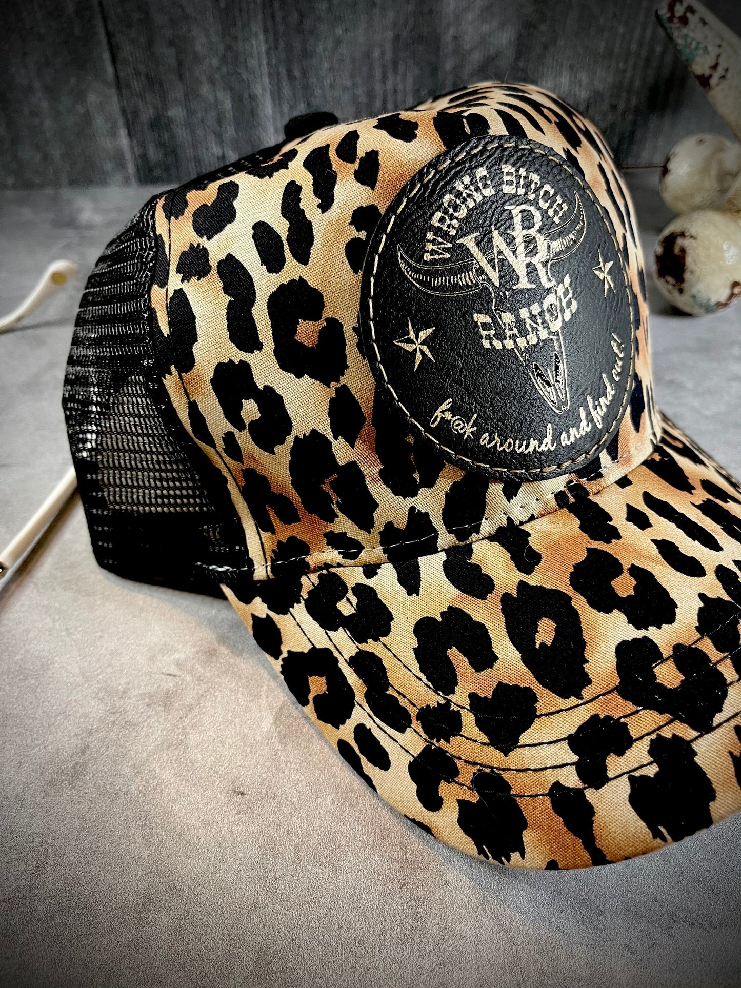 Feed Store Couture, By Joi. Wrong Bitch Ranch, fuck around & find out, womens white or brown leopard reg and ponytail trucker cap