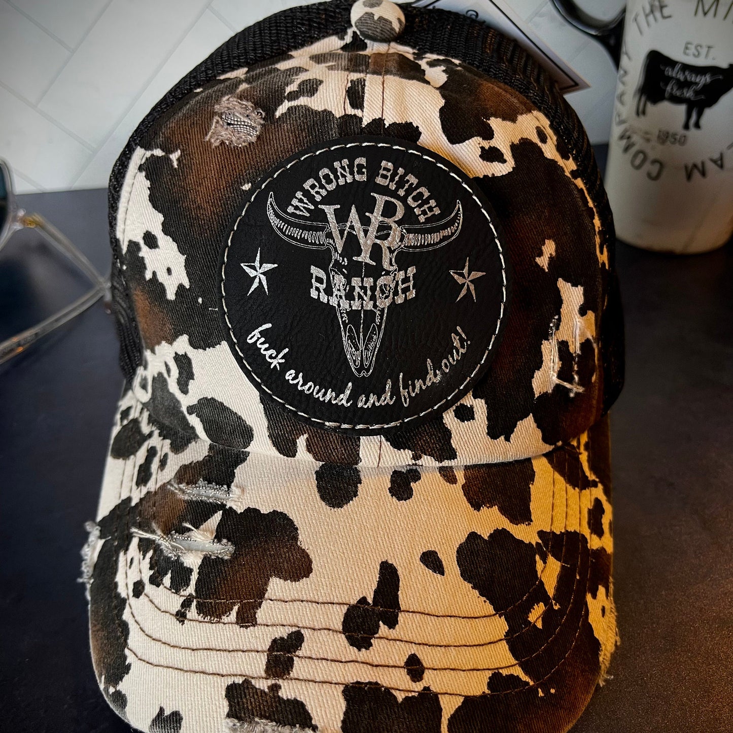 Women’s Cow Print Ponytail Trucker Hat